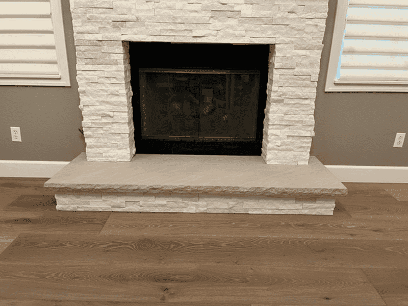 Custom Limestone hearth with chisel edge